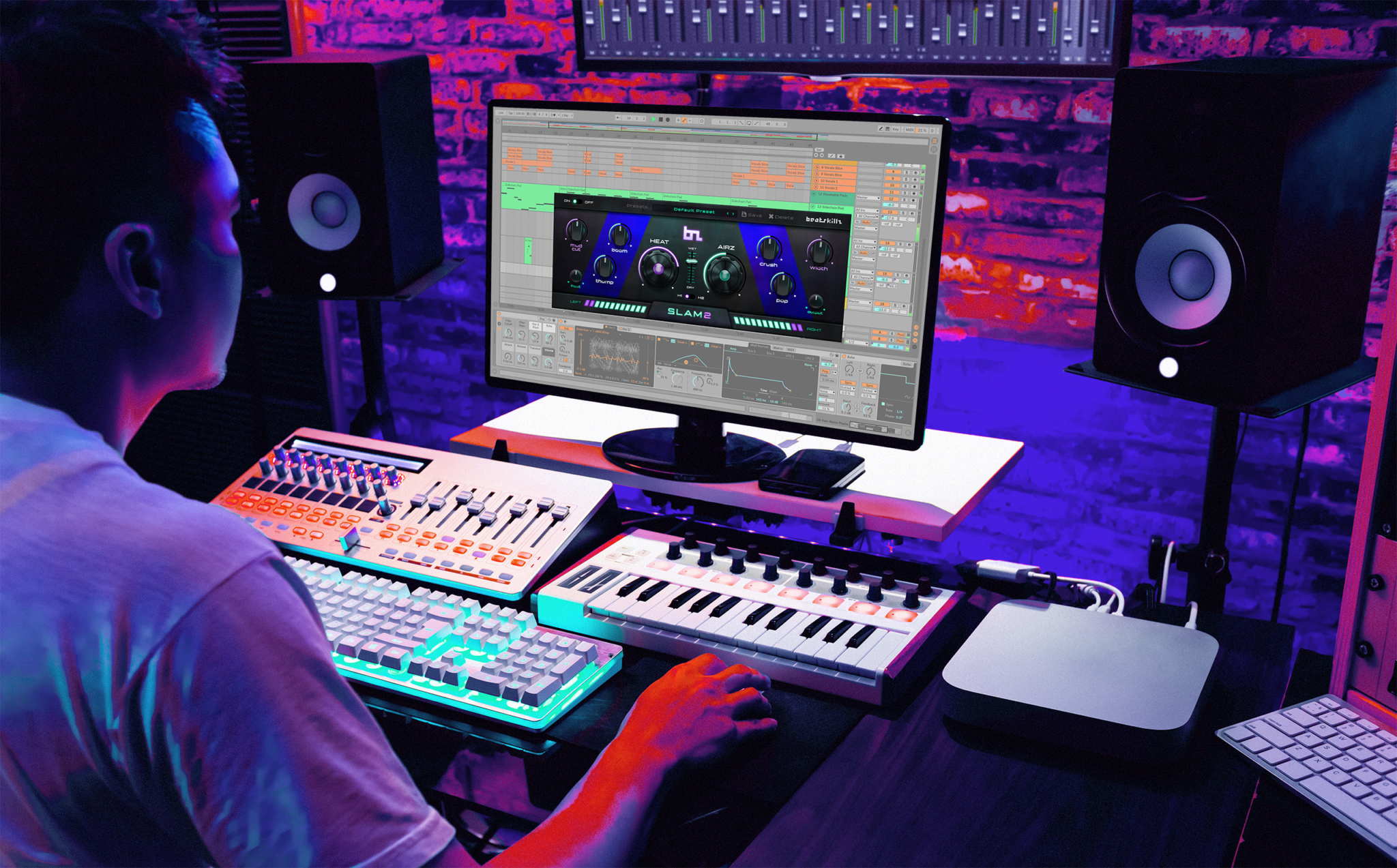 A producer working with Slam2 in the studio